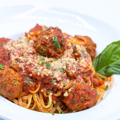 Linguine and meatballs with tomato sauce and Parmesan.