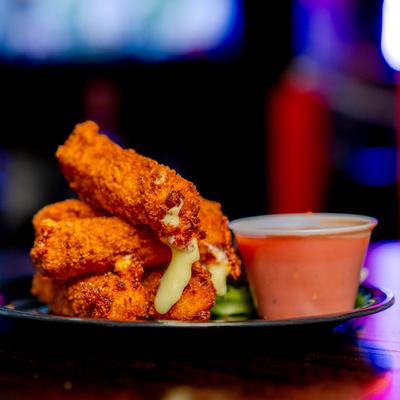 Mozzarella sticks with dipping sauce.