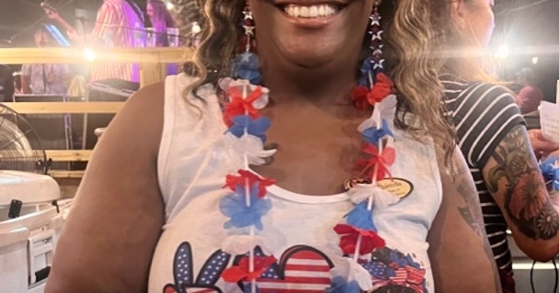 Employee serving BBQ Plate