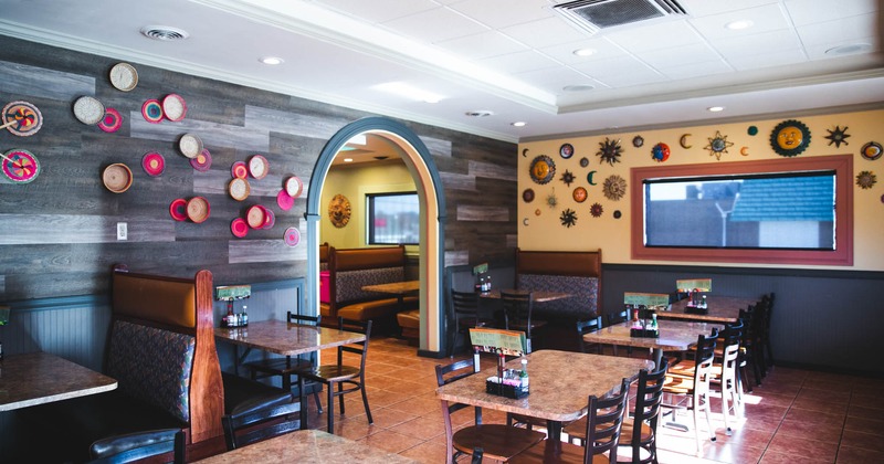 Dining tables with decoration details on the walls