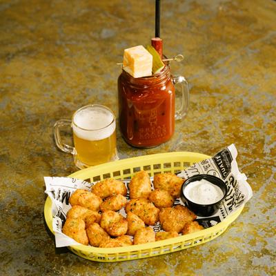 Curd's the word served in a basket, bloody Mary cocktail.