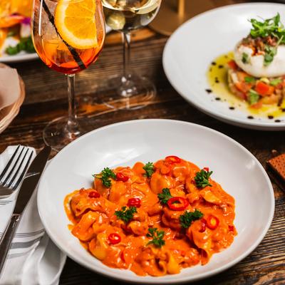 Spicy stuffed pasta with sausage, Calabrian chilies, and tequila pink cream sauce.