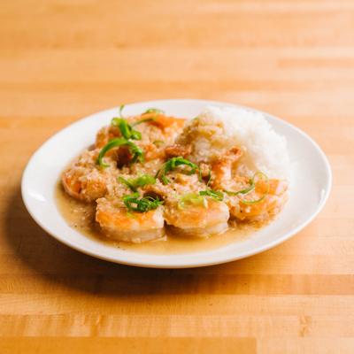 Garlic shrimp served with rice.