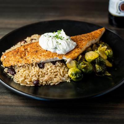 Fried white fish with rice and Brussels sprouts