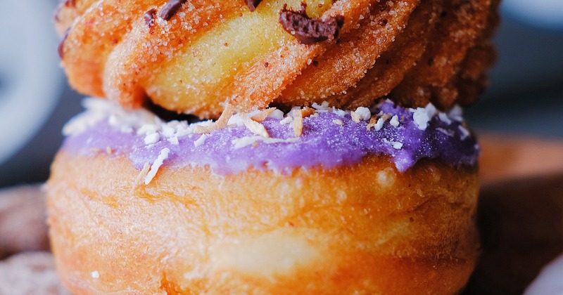 Donuts with purple frosting and chocolate chips