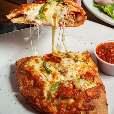 Calzone, with melted cheese.