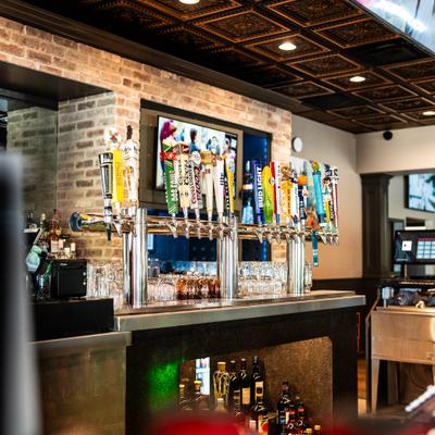 Bar counter with multiple beer taps.