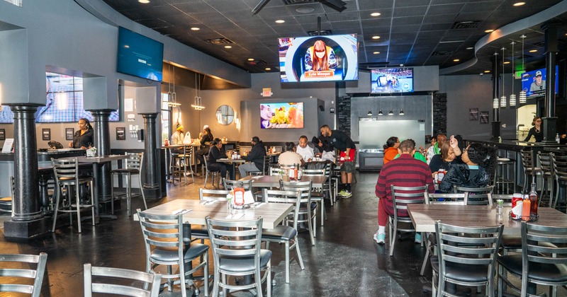 Diner area, tables, chairs and tv above