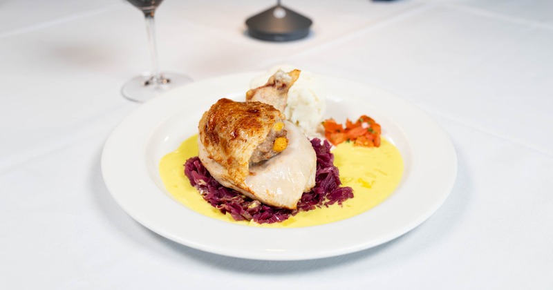 Roasted chicken served over braised red cabbage