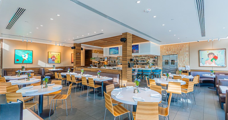 Spacious, modern and cozy interior dining area with set dining tables