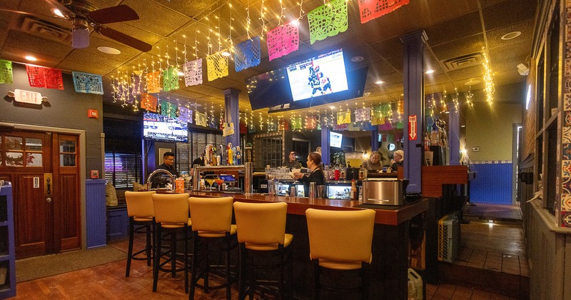 #interior, bar, stools, drink rack, screens above