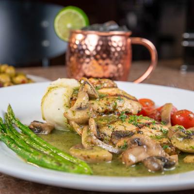 Chicken in basil pesto sauce, with garlic mashed potatoes, asparagus, and mushrooms.