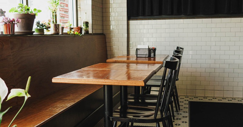 Interior, tables and chairs near window