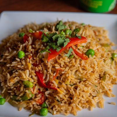 A plate of chicken fried rice.