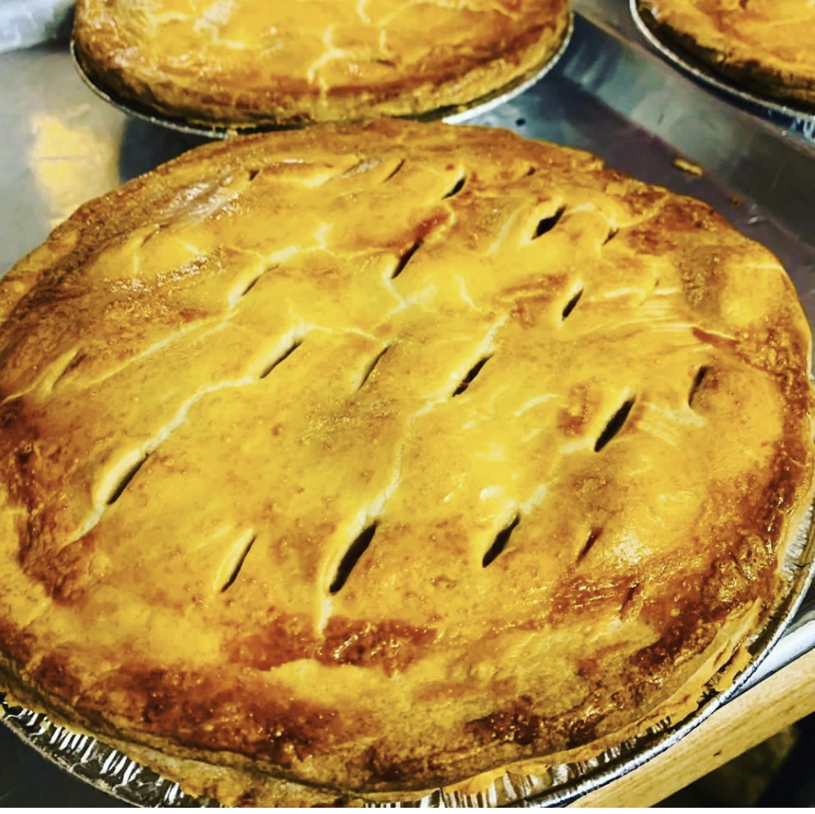 Golden brown pies with flaky crusts and slotted tops