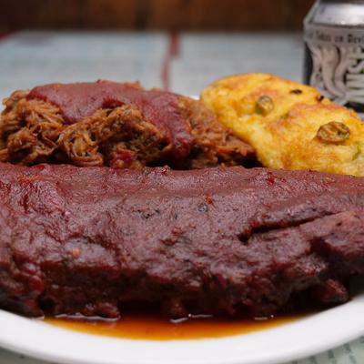 BBQ ribs, pulled pork, and a baked potato.
