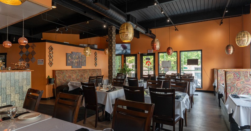Interior, tables set for guests in dining area