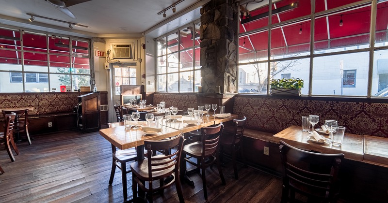 Restaurant interior, dining area with set dining tables