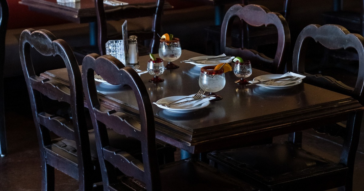 Interior, seating area with wooden tables and chairs