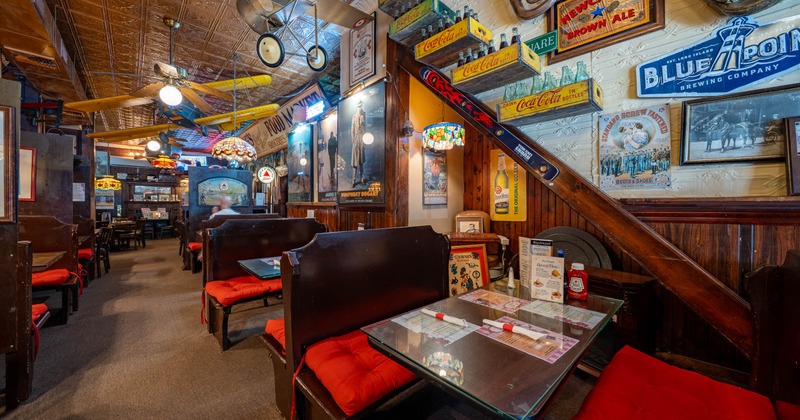 Interior featuring vintage memorabilia and airplane models suspended from the ceiling