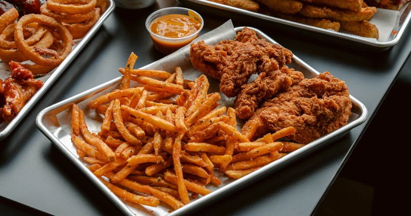 Fried chicken tenders served with thin fries