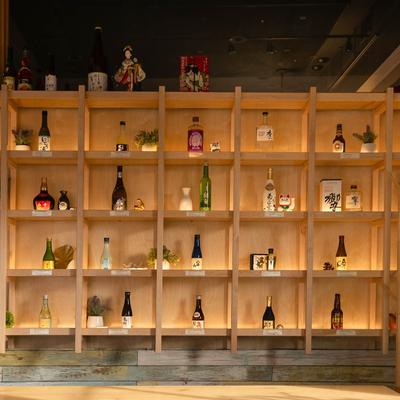 Various liquor bottles on the shelf.