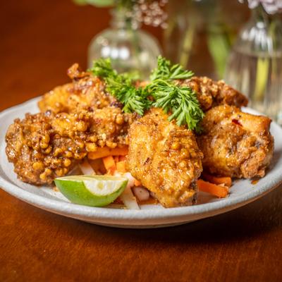 Crispy wings tossed in caramelized fish sauce with garlic, cilantro, and lime.