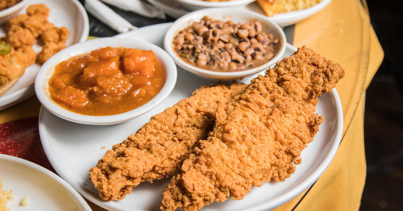 Two Fried Catfish Fillets served house batter and cornmeal dip