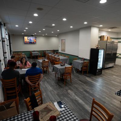 Interior ,diner area, wide view, tables, chairs.