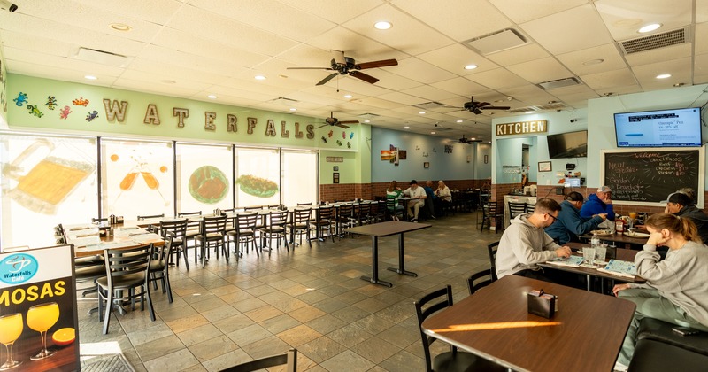 Spacious interior dining area with guests enjoying their food