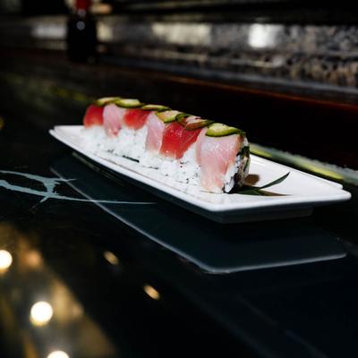 Sushi rolls topped with tuna and yellowtail.