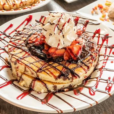 Pancakes with Nutella, strawberry and whipped cream