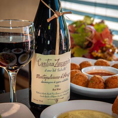 Arancini balls and red wine.