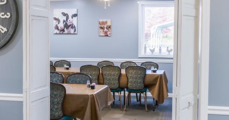 Doorway to a room with dining tables