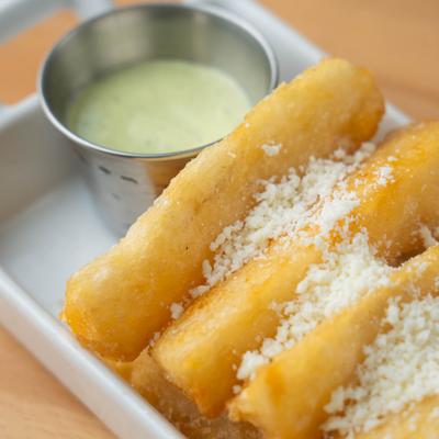 Yucca Fries served with a sauce for dipping.