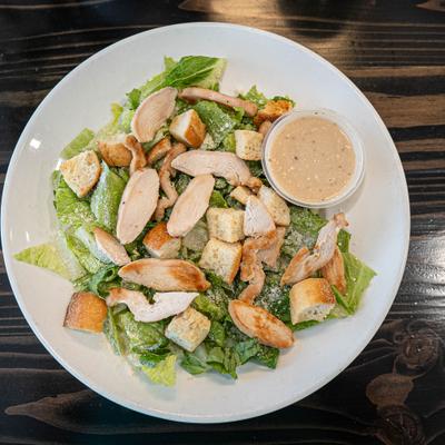 Chicken Caesar salad in the plate