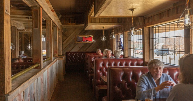 Interior, guests sitting in booths
