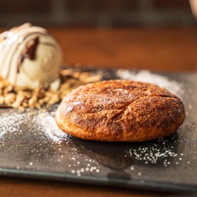 Crispy Hotteok pancake served with ice cream on the side.