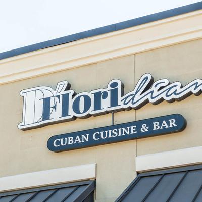 The restaurant name on the side of the building.