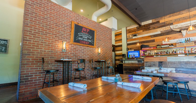 Interior, dining tables set up and bar