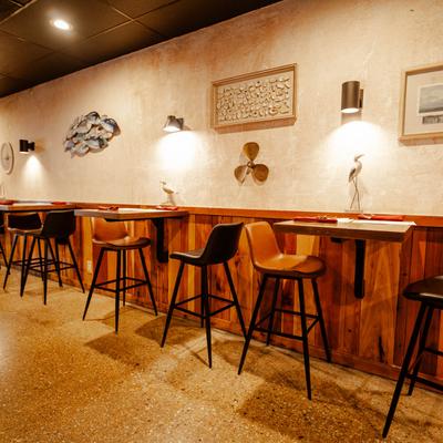 Interior, tall tables and bar stools.