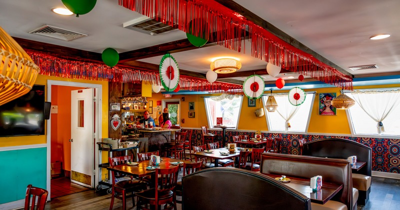 Interior, vibrant dining area with leather benches