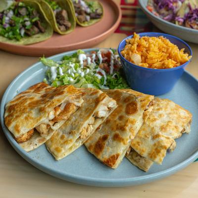 Chula Quesadilla served with rice and a salad.