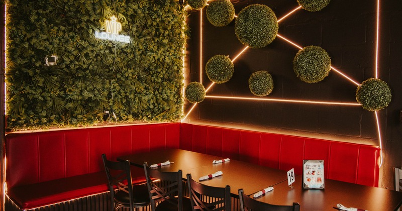 Interior, VIP room, corner banquette bench with tables and chairs