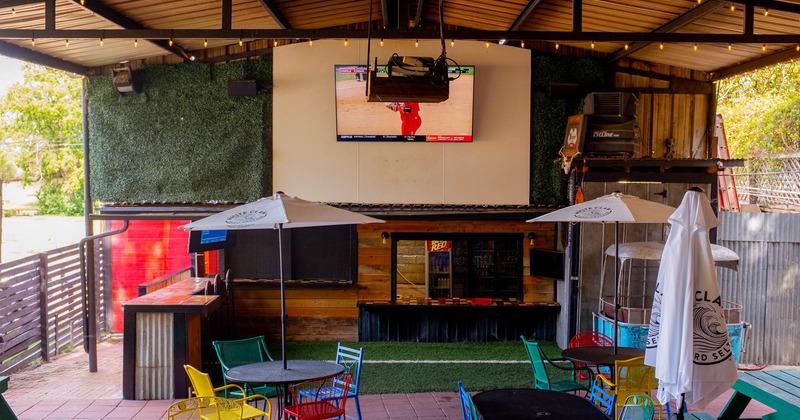 Covered seating area with big TV screen
