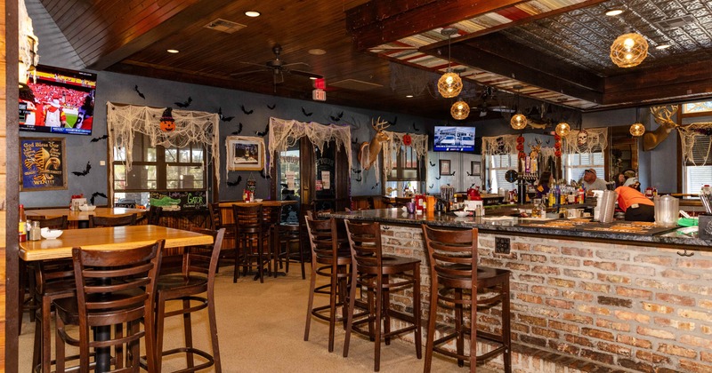 Interior, seating area with a bar on the right