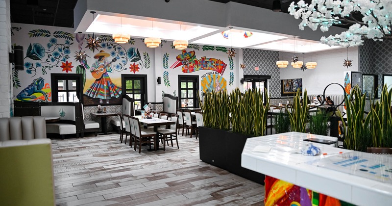 Interior, dining booths with tables and chairs