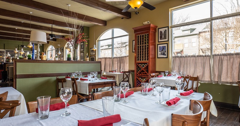 Interior, dining tables with glasses and accessories