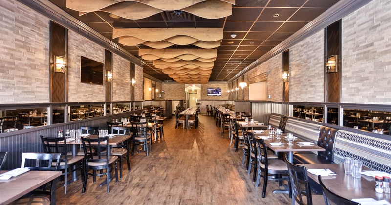 Interior, dining area, regular tables for four, long banquette bench with tables and chairs