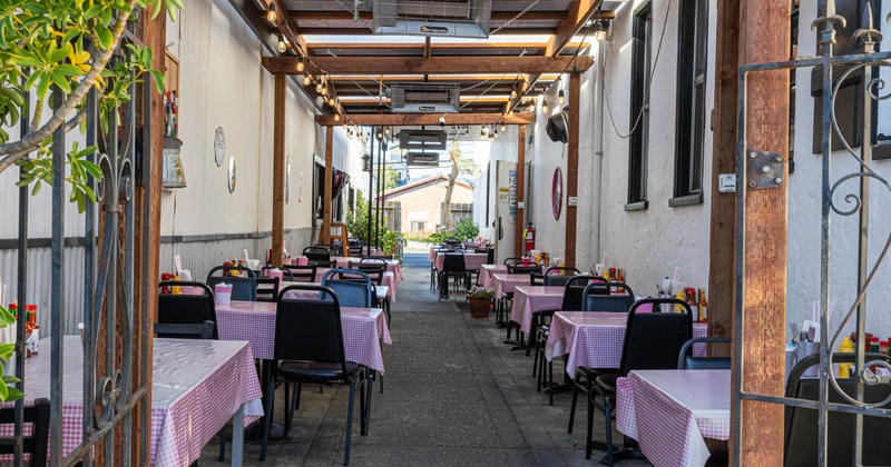 Covered patio with tables and chairs